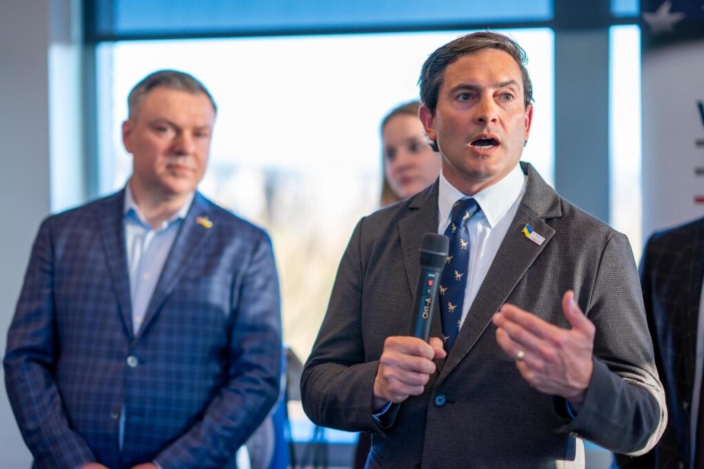 With Honor Co-Founder and CEO Rye Barcott speaking at a Ukrainian event.